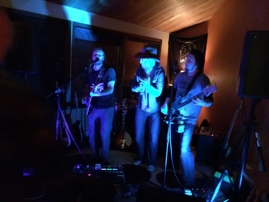 A band playing in a lake house living room in 2014