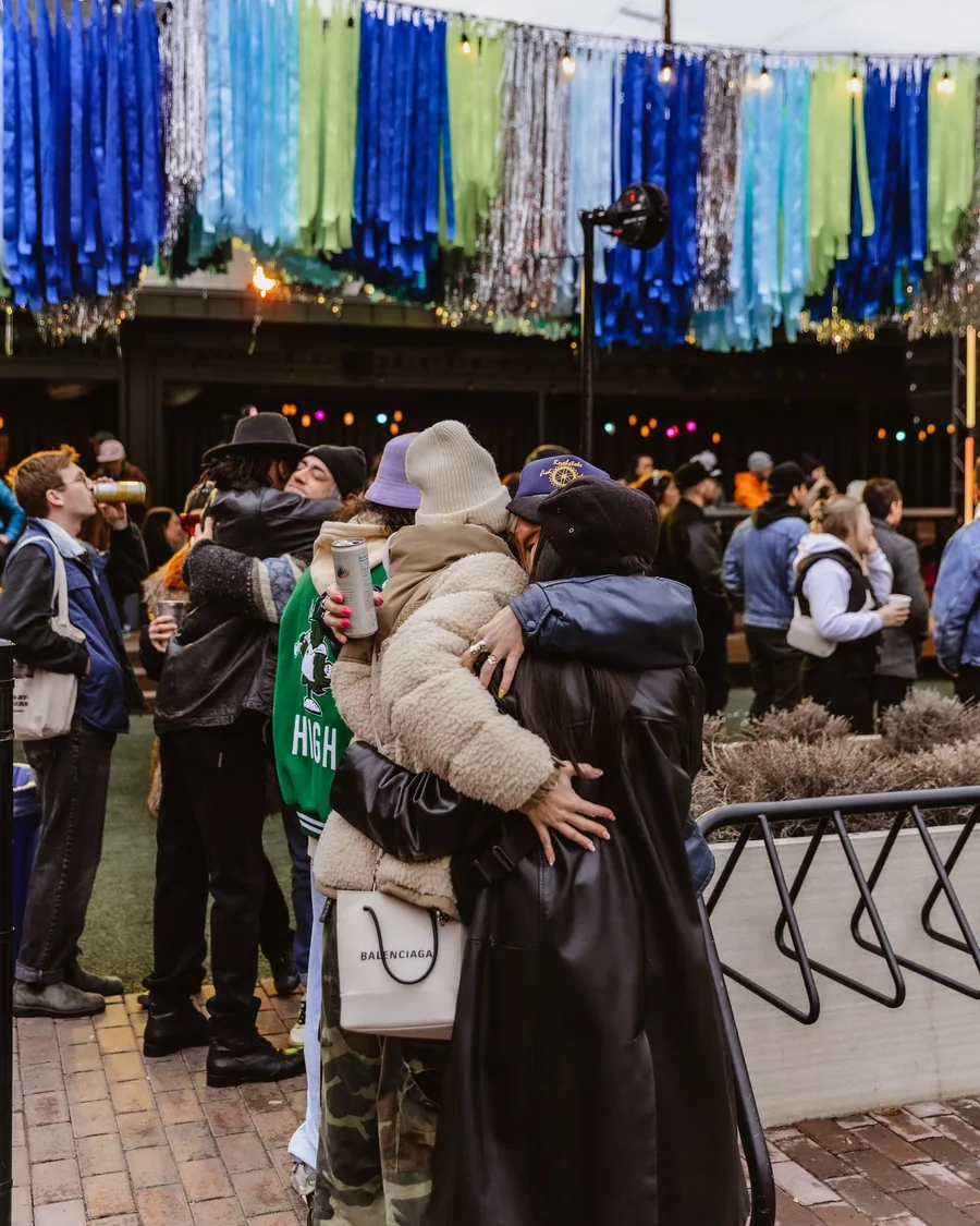 A Fireside attendee in a fur coat on the dance floor